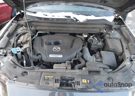 2021 Mazda Cx-5 Signature z USA, uszkodzony, nr VIN JM3KFBEY6M0358024